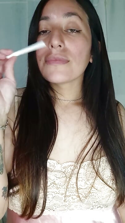 A Chubby Girl Smoking and Playing with Her Boobs