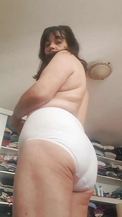 Mature stepmother showing her large panties to stepson on camera