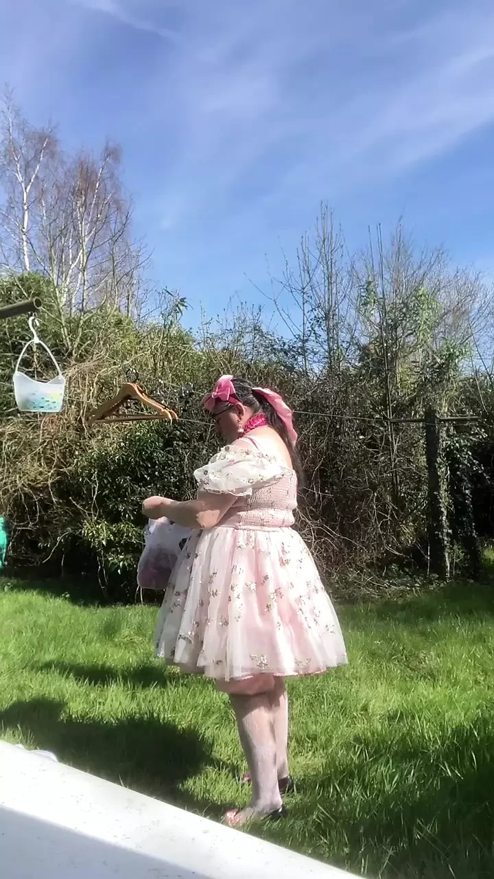 In a babydoll outfit to hang out the laundry outside