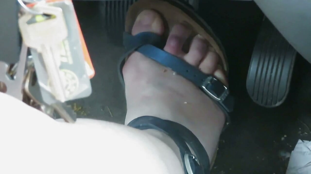 Pedal Pushing Nurse Vicki works her car pedals  in sandals