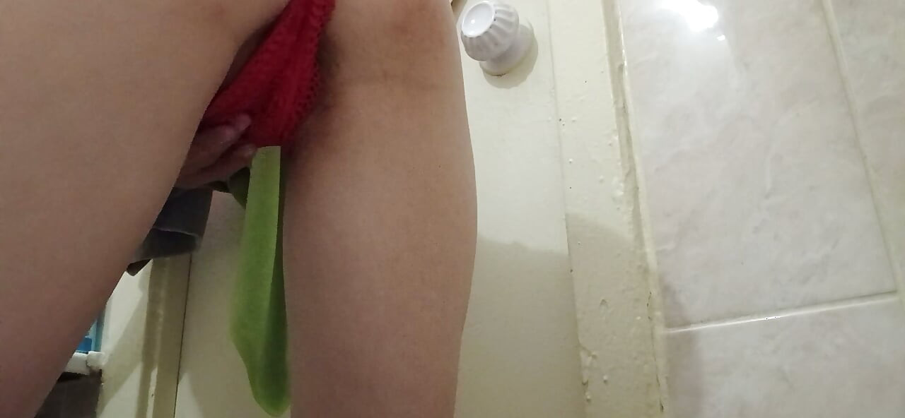 A skinny student girl in red panties masturbates her hairy pussy