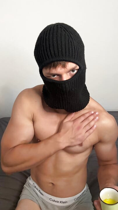 Masked horny hunk oiled up and teasing
