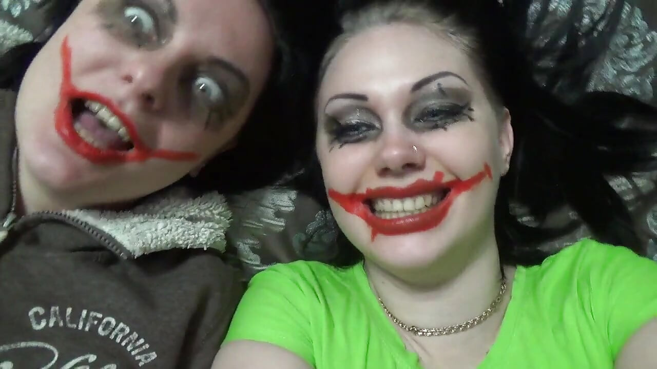 Two crazy clown girls dangle you above their hungry mouths before fighting over who will eat you alive