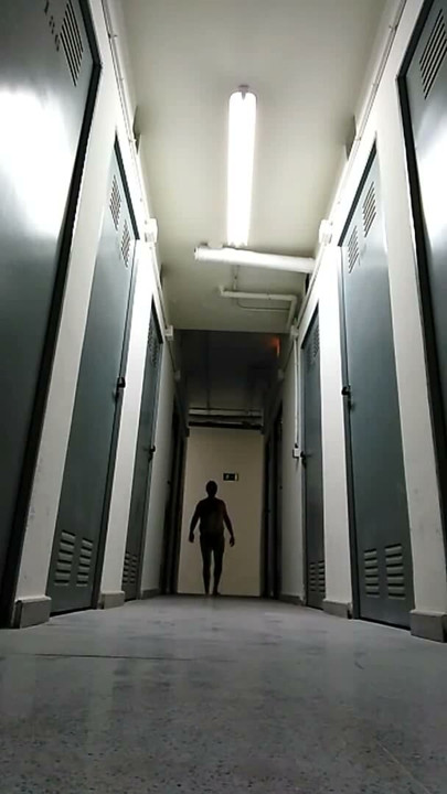 Nude in a public hallway