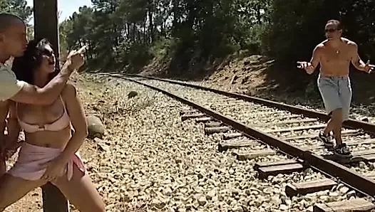 Stunning French babe gets fucked by two dudes on the railway