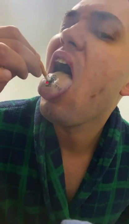 Cigarette extinguished on tongue. extreme smoking, masochistic fetish, pain smoking, tongue torture.