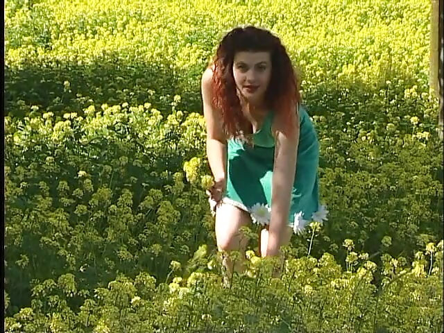Busty redhead teen lifting dress outdoors