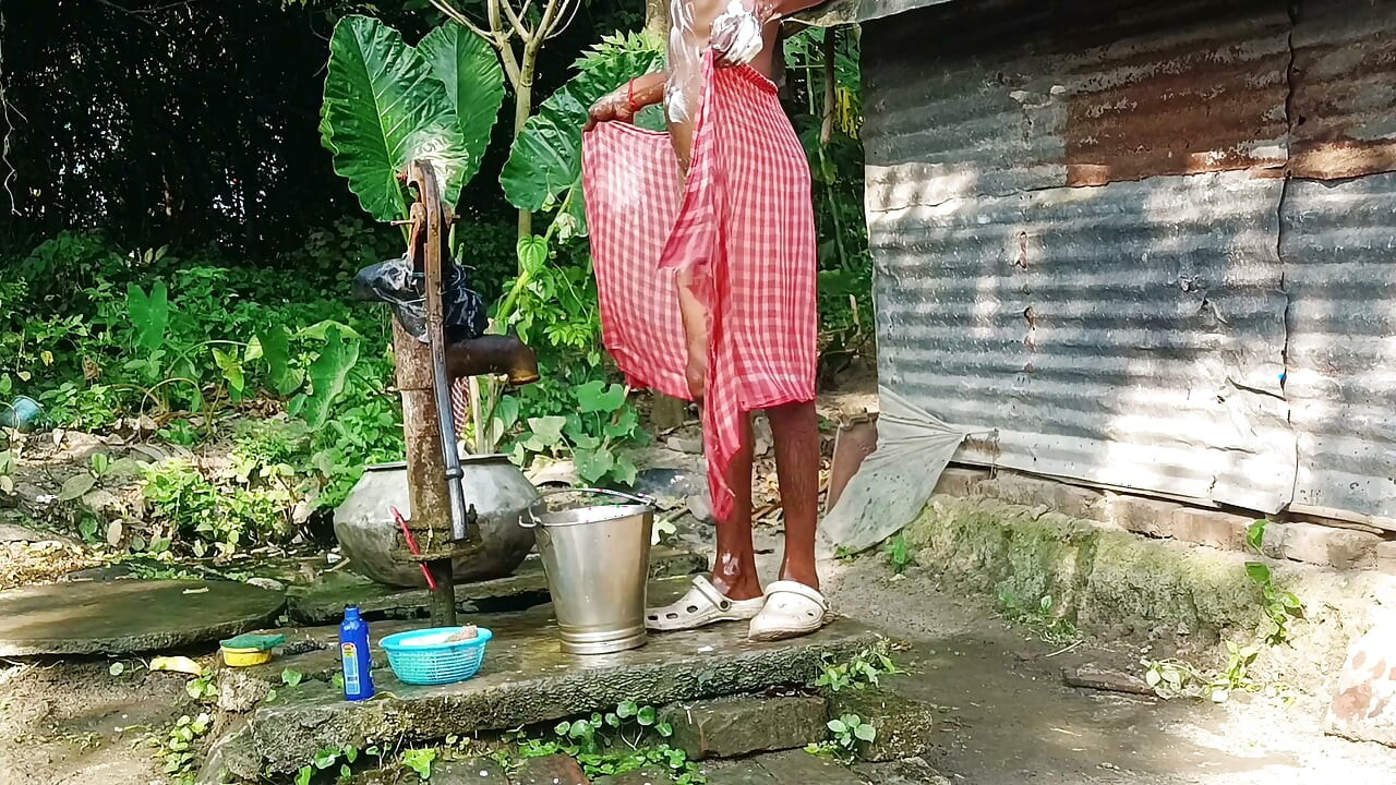 Desi young man bath Open place.
