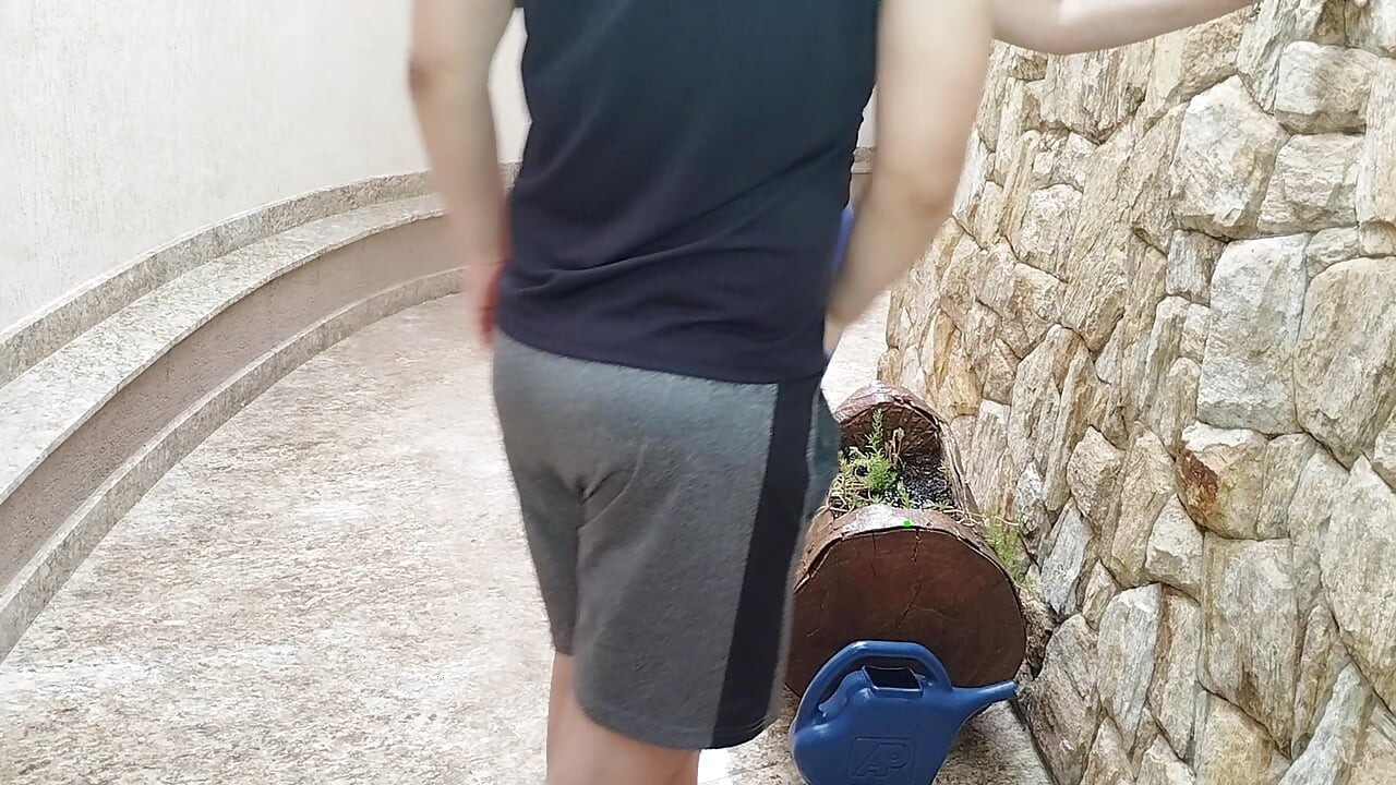 Stepmom was watering the flowers wearing gym shorts when the stepson started rubbing his cock in her ass