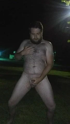 Cumming outside in front of the road