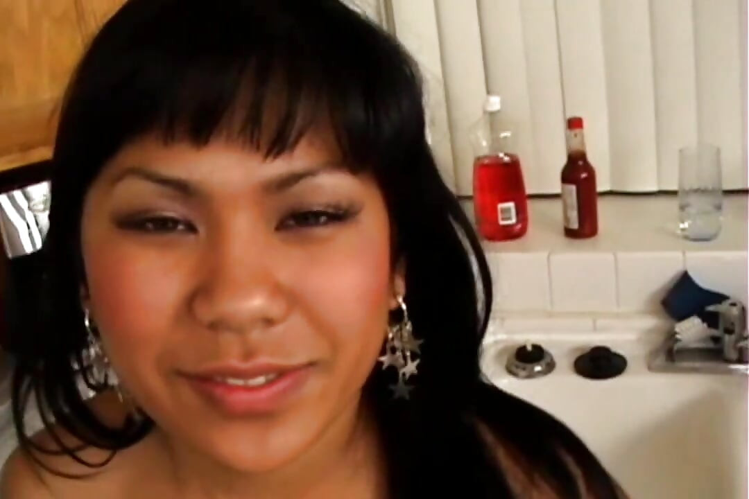 Cute Asian Girl Sucks a Big Black Cock and Gets Fucked in the Kitchen