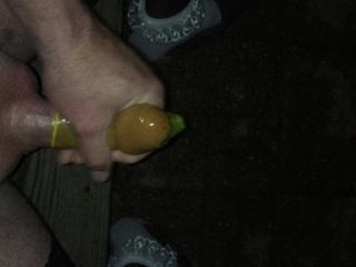Cross dresser jerking cock into condom outside