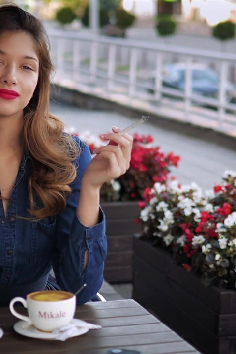 Magnetic Russian Beauty Playing with Cigarette Smoke