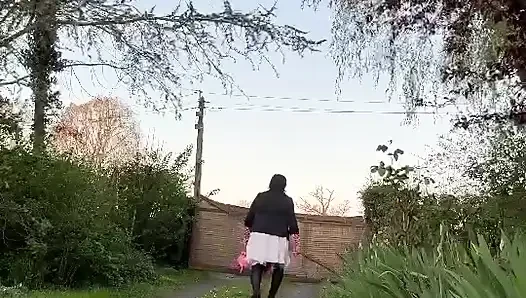 In casual attire with a white skirt one evening