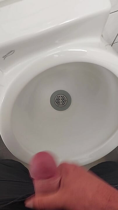 Moaning daddy has a lot of pressure and milks his cock in the public toilet