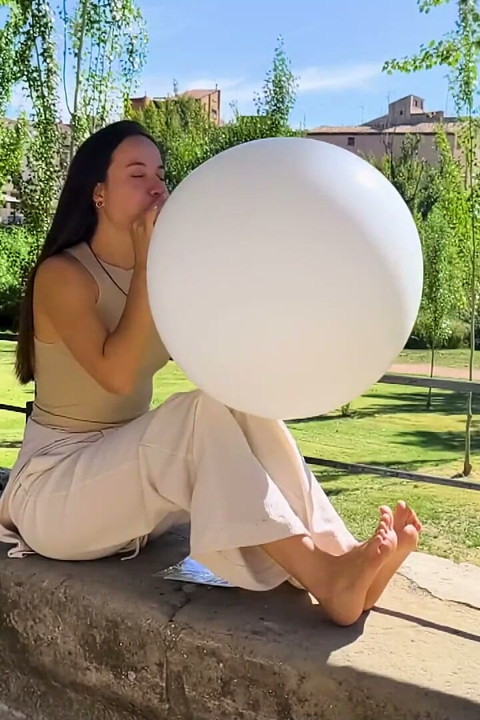 Inflating and Popping Them with Bare Feet Outdoors