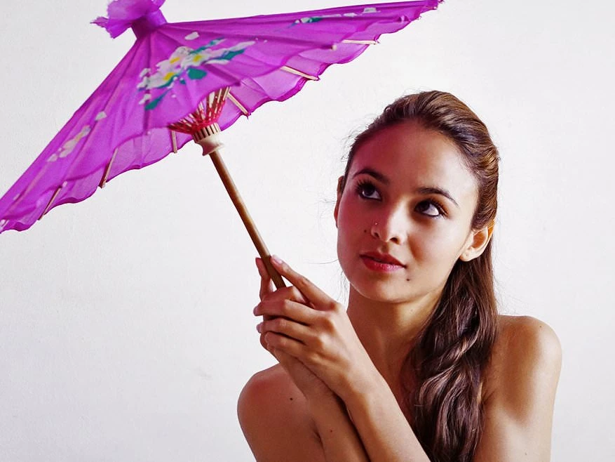 Fedra toying her pussy with a purple parasol