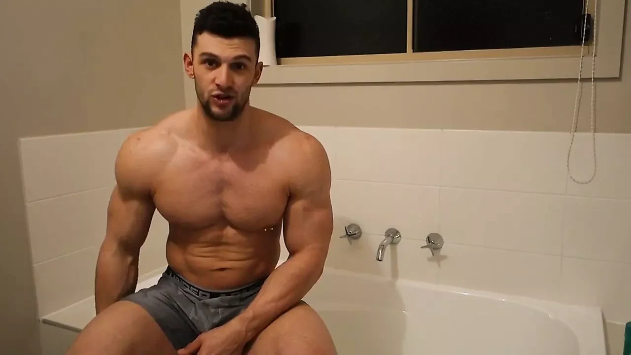 Muscle bodybuilder takes a bath and worships his soapy body