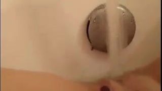 Shaved MILF water fun!