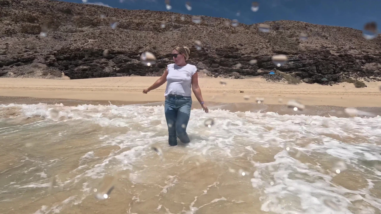 Girl Wetting Jeans in the Ocean and Swimming in Wet White T-shirt