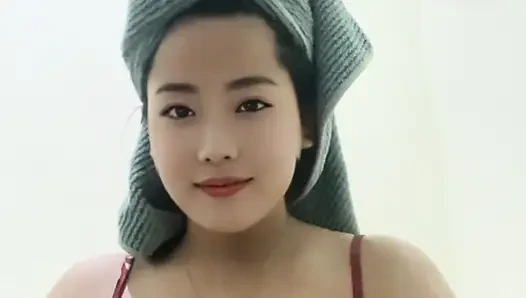 Young mommy looking beautiful after a shower, squeezing her big tits.