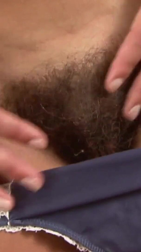 Brunette with small tits gets a cumshot on her hairy pussy | Clip 1