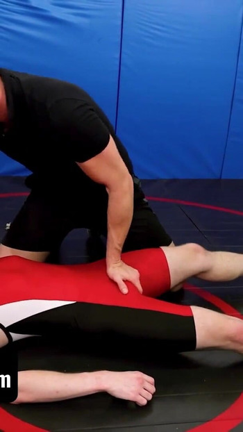Captivating moment from "Varsity Grip - Hunk Coach Brian Bonds Drills Young Twink Wrestler In Spandex After Practice"
