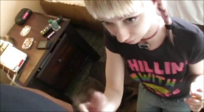 Ponytailed blonde teen jerking dick while smoking a cigarette