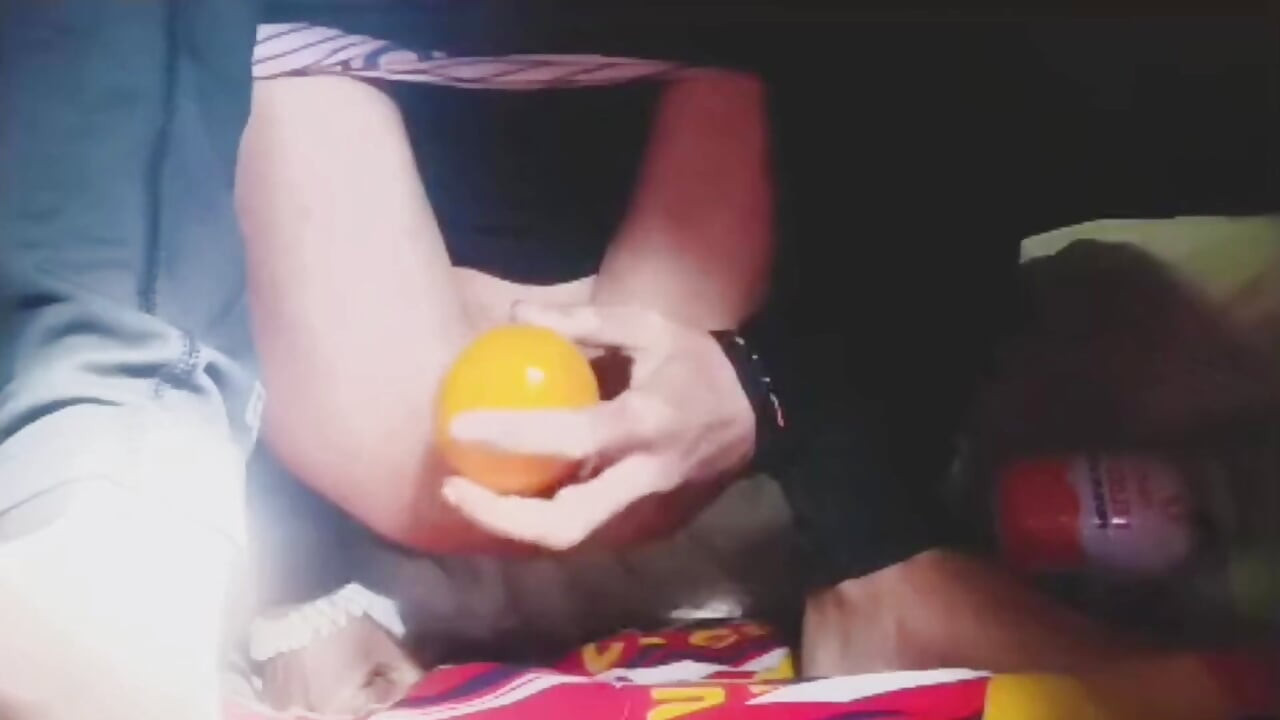 A Young Man Stuffs a Crystal Ball and an Orange up His Tight Ass.