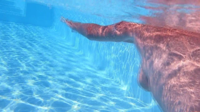 mature underwater in swimming pool