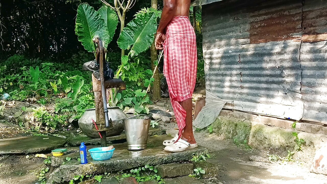 Desi young man bath Open place.