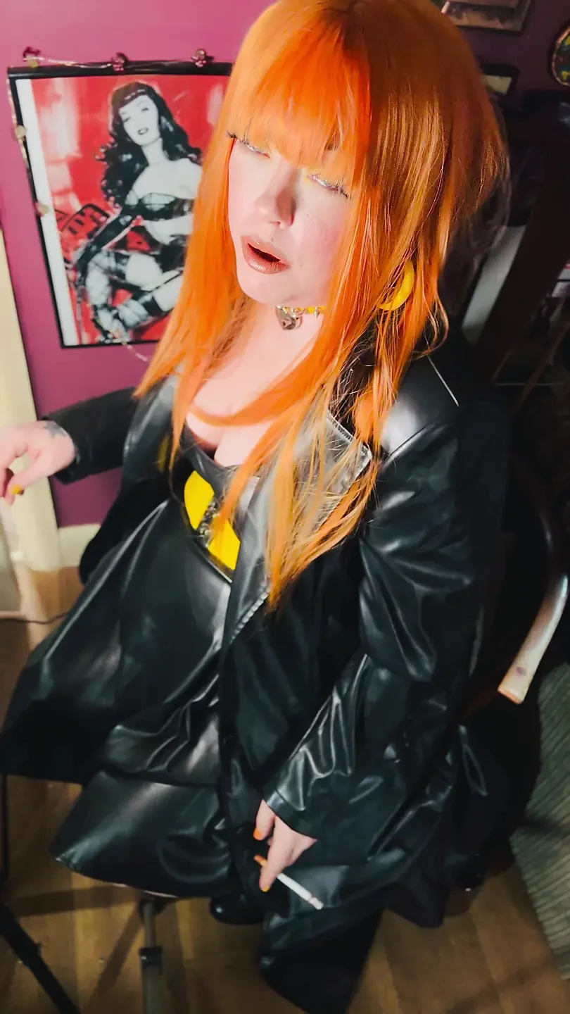 The Gothic Cutie Tina Snua Dressed In a Leather Coat & Smoking A Cork 100 Cigarette - Ginger Miss Smokes In A Leather Outfit OME