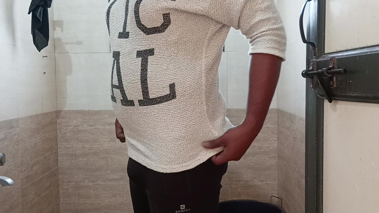 Indian boy wearing bra and panties in batharoom.