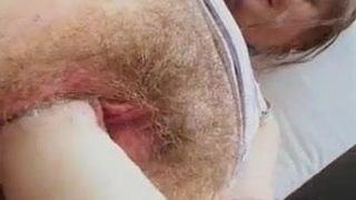 amateur slut fingers and toys her hairy cunt