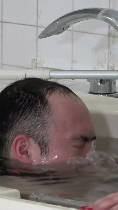 Japenese girl submerges a man into the bathtub with a facesitting | Clip 1