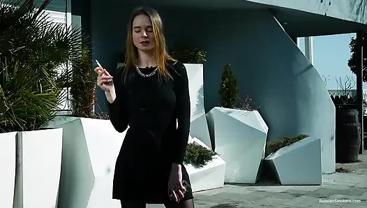 Young Russian Girl Smoking Cigarette by Seaside