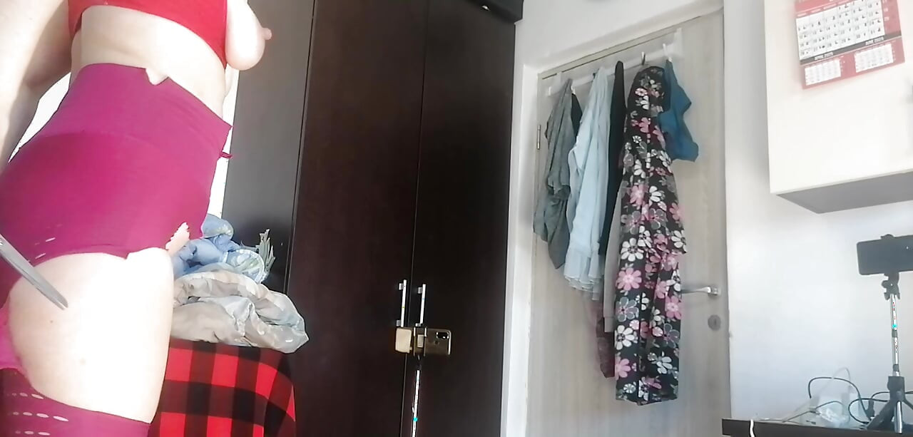 Sexy Latina Having Fun Trying on Clothes and Cutting Them
