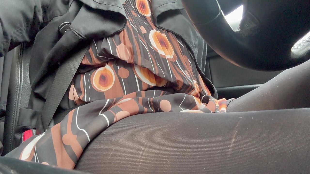 Elegant stepmom drives to the office wearing tights and a beautiful dress