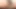 Busty ladyboy in colorful bikini strokes her shaved dick