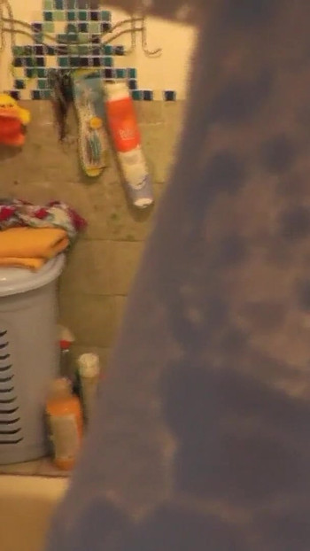 Must-see moment from "Stepmom goes to bathroom, wanks pussy, student stepson watches"