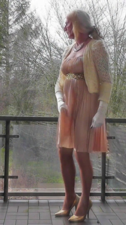 Memorable moment from "Wanking On A Winday Day In My Shiny Pleated Satin Gown"