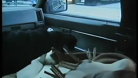 Commuter redhead carpools with creep who debases her in car in city traffic