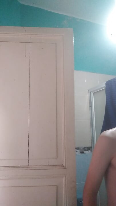 Handsome man washes his face