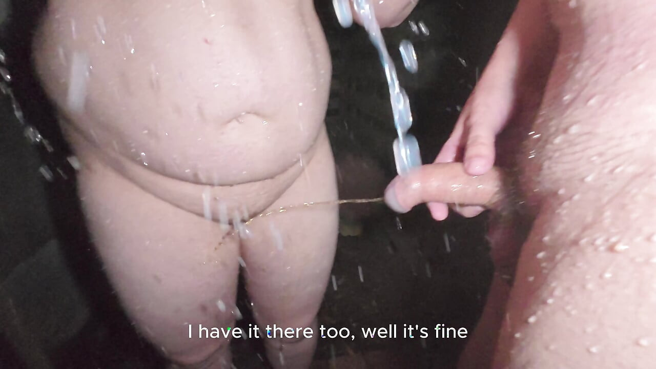 Soapy naked bodies in a rural shower