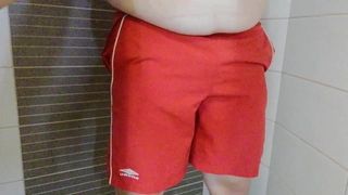 Pissing in my colleague's swimming trunks