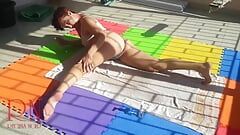 An attractive lady is sunbathing on the roof of her house. Nude yoga Tans 2
