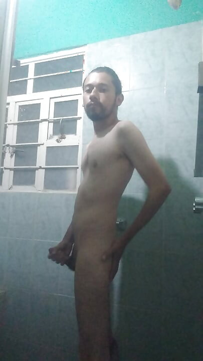 Handsome guy takes off his blue sweater and masturbates