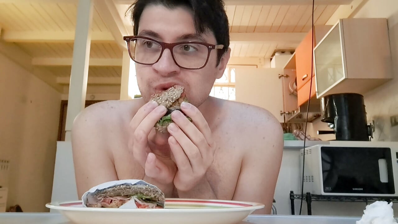 Pig guy eats a sandwich while jerking big cock
