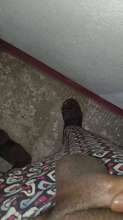 Young boy massages his big penis in a closed room