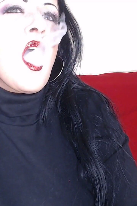Closeup smoking red glittered lipstick